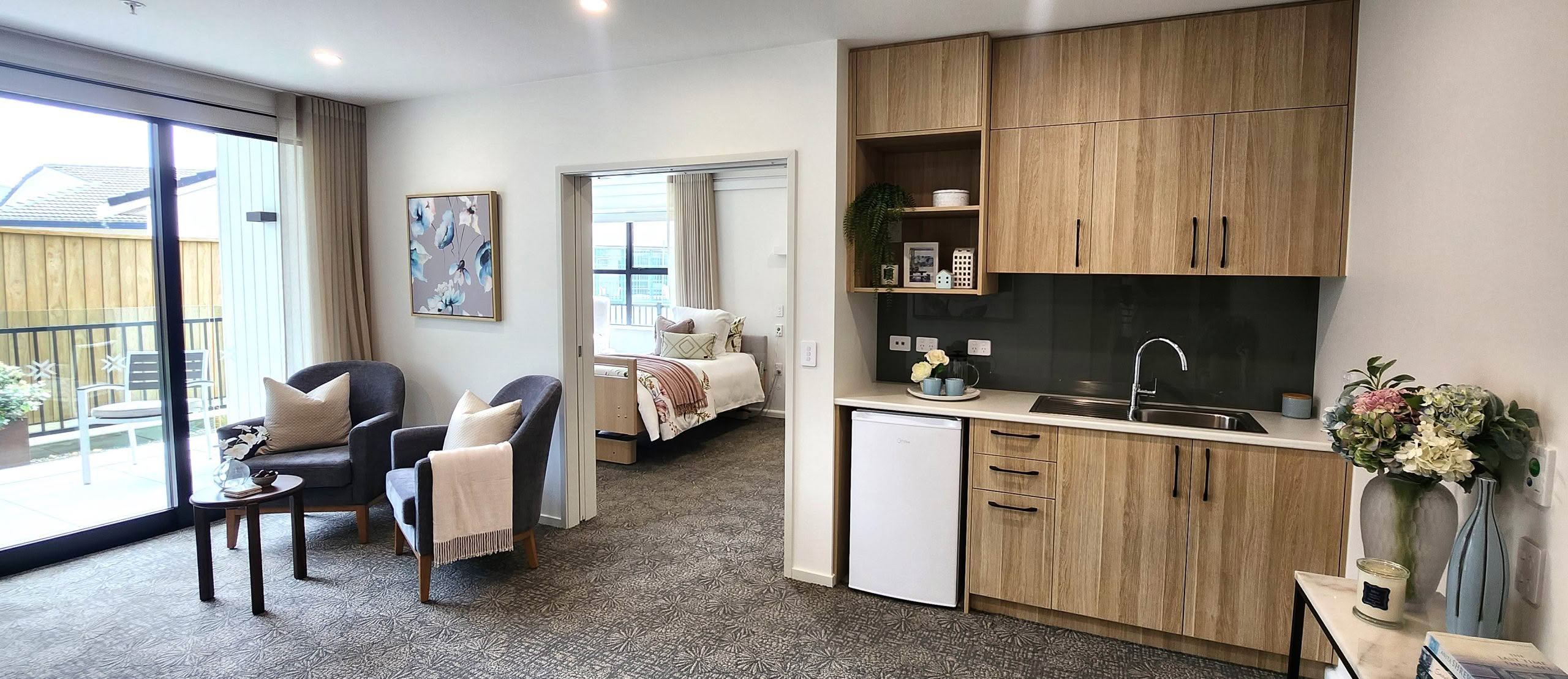 Care suite bedroom and ensuite at St Andrew's Village