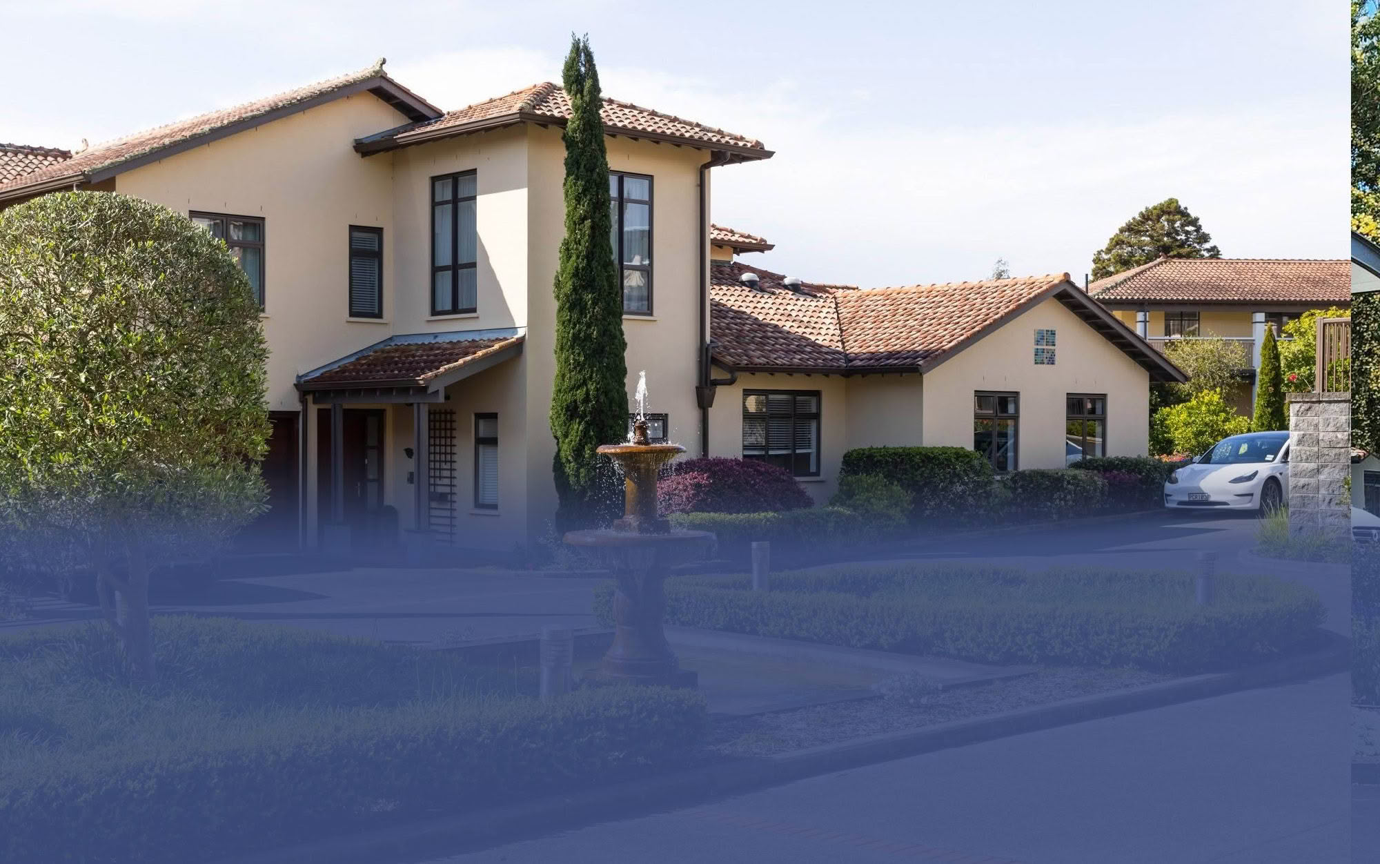 Manicured gardens and villa exterior at St Andrew's Village