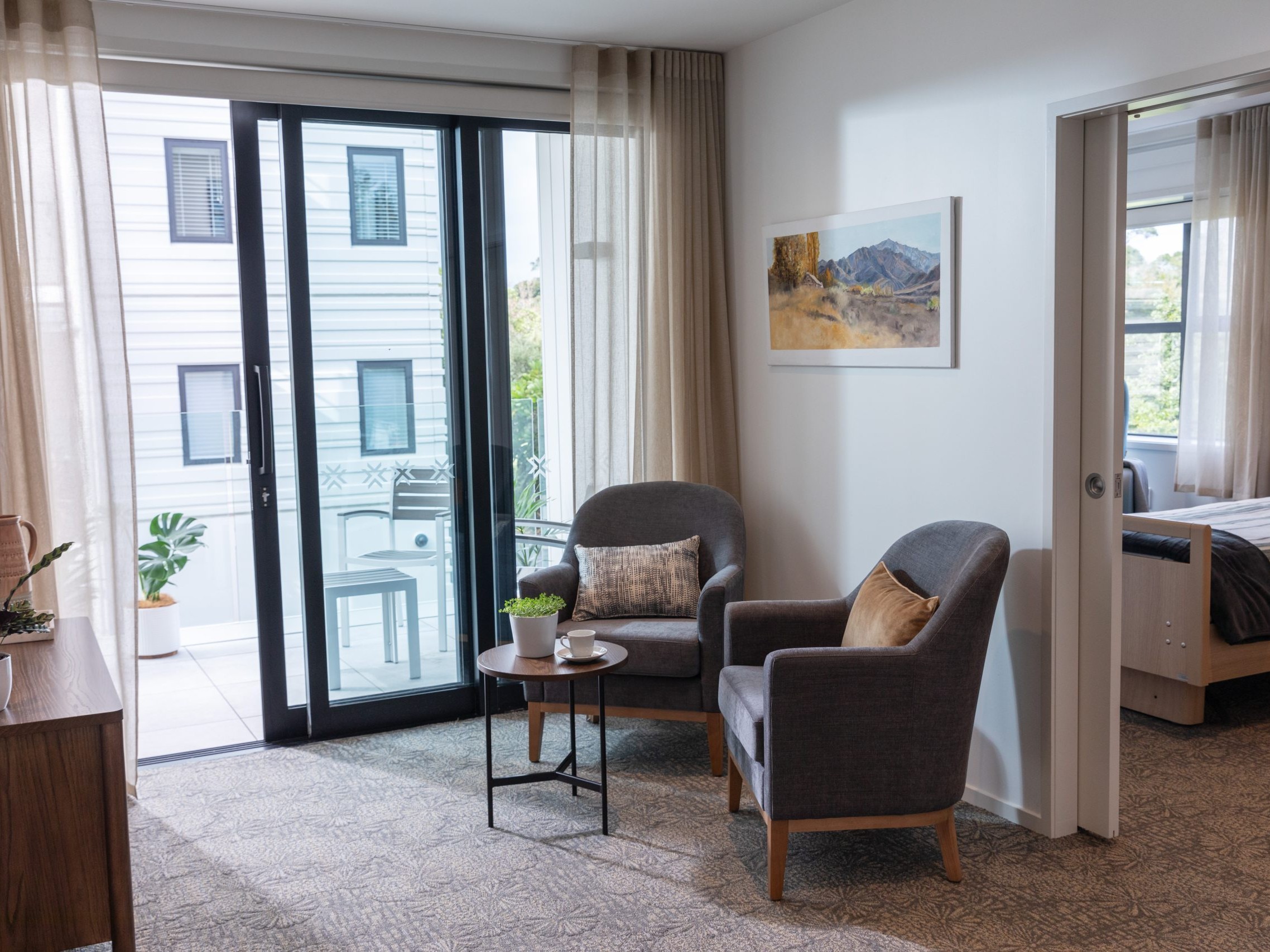 Care suite lounge with kitchenette viewed from the front doorway
