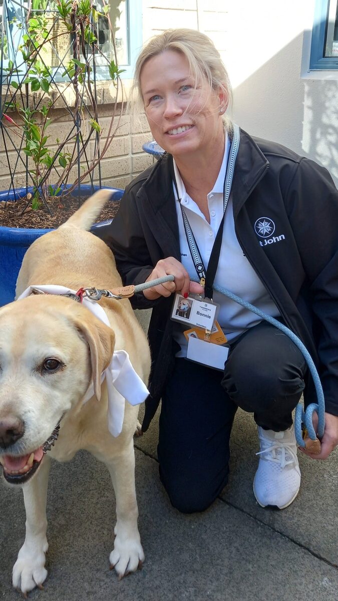 A volunteer sharing a laugh with a resident